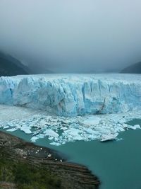 Scenic view of glacier against sky