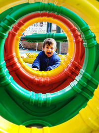 Portrait of smiling kid playing at playground