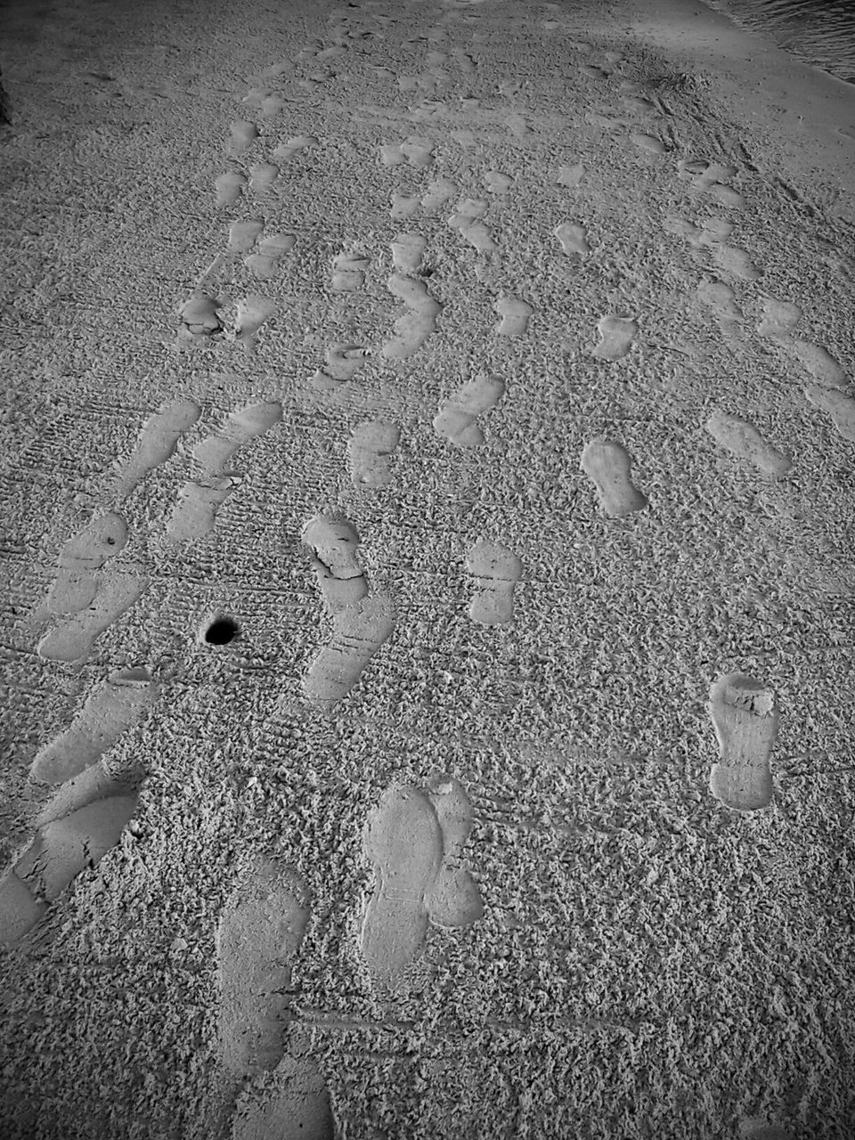 beach, sand, high angle view, shore, wet, water, nature, footprint, day, outdoors, tranquility, sunlight, no people, textured, full frame, backgrounds, street, pattern, sea, beauty in nature