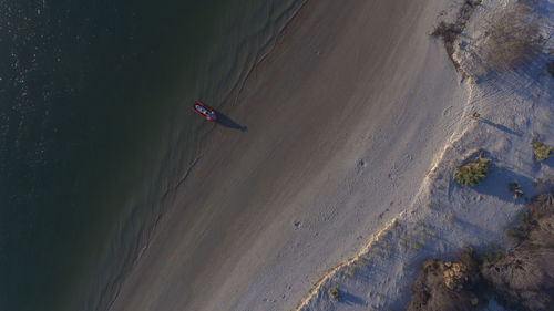 High angle view of people on sand at beach
