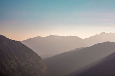 Scenic view of mountains against sky during sunset