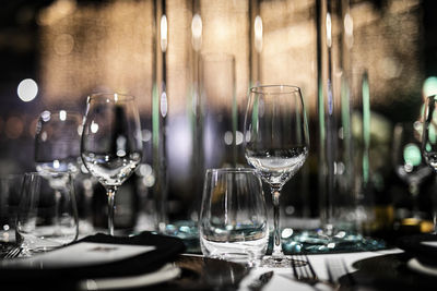 Drinking glass on table in restaurant