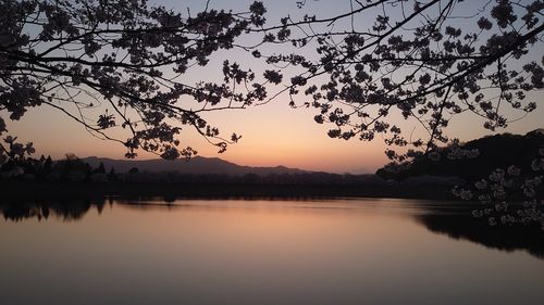 Scenic view of lake against sky during sunset