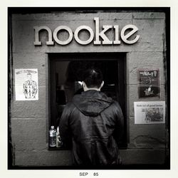 Close-up of woman standing on wall