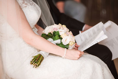Woman holding flower bouquet