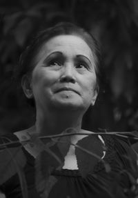 Portrait of young woman looking up