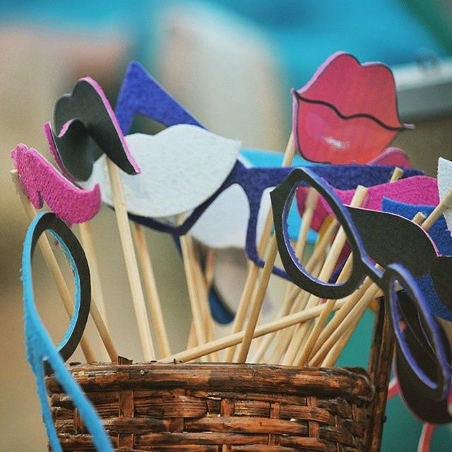 focus on foreground, close-up, blue, no people, flower, still life, day, multi colored, indoors, wall - building feature, wood - material, metal, chair, art and craft, sunlight, selective focus, purple, hanging, table