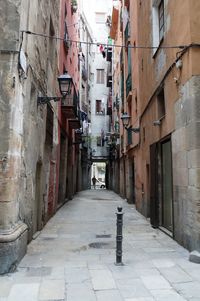 Narrow alley amidst buildings in city