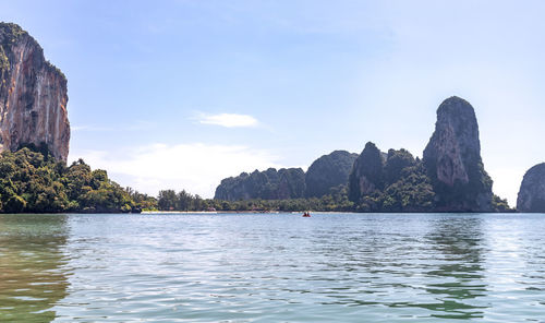 Scenic view of sea and mountains against sky