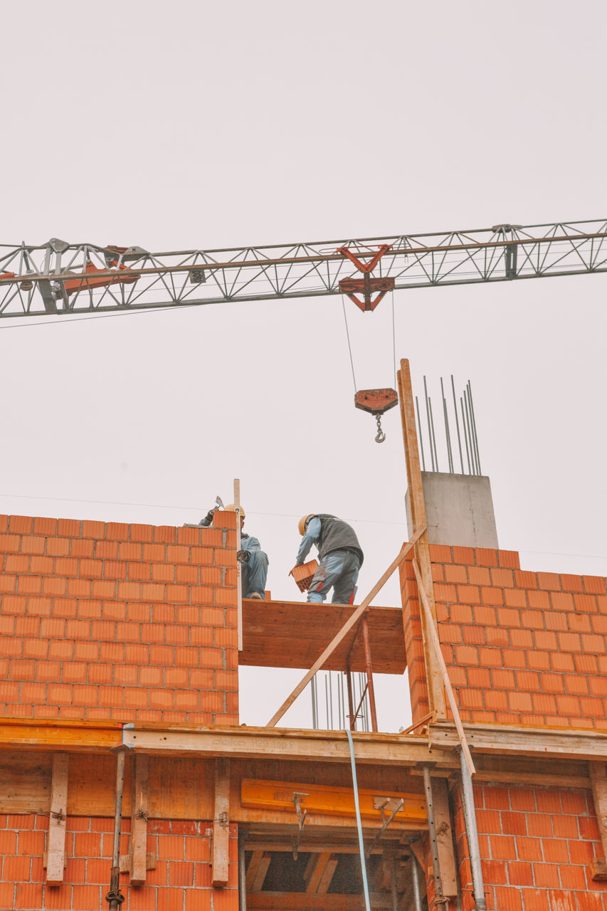 LOW ANGLE VIEW OF CONSTRUCTION SITE AGAINST SKY