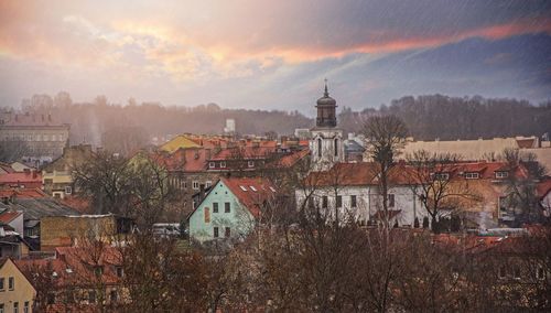 Cityscape against sky during sunset