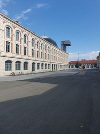 Building in city against blue sky