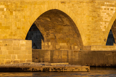 Arch bridge over building