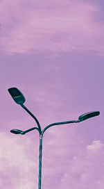 Low angle view of street light against sky