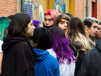 Fashionable people with dyed hair in city