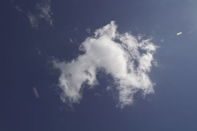 Low angle view of smoke emitting from sky at night