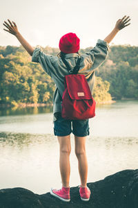 Full length of man standing in lake against sky