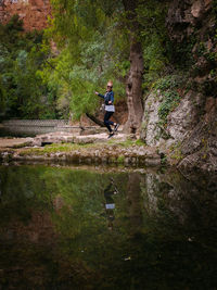 Woman jumping in forest