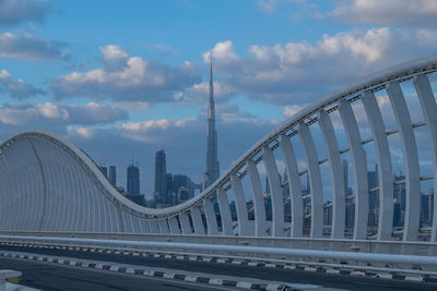 Maidan bridge dubai with dubai skyline