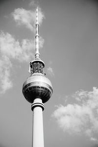 Low angle view of communications tower against sky