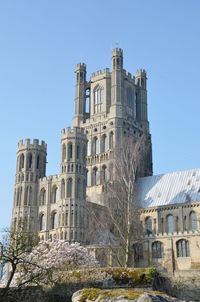 Low angle view of historical building against blue sky