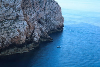 High angle view of rock formation in sea