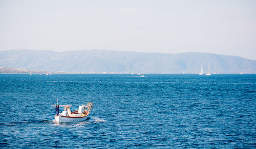 Boat sailing in sea