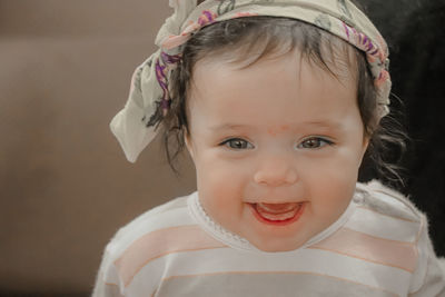 Close-up of cute girl at home