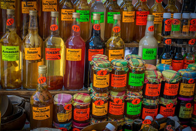 Multi colored bottles on display at store