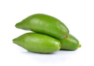 Close-up of green pepper against white background