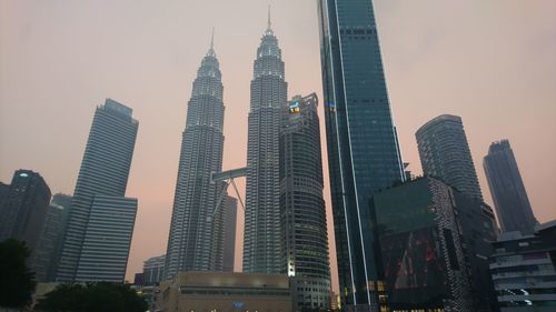 Skyscrapers in city against sky