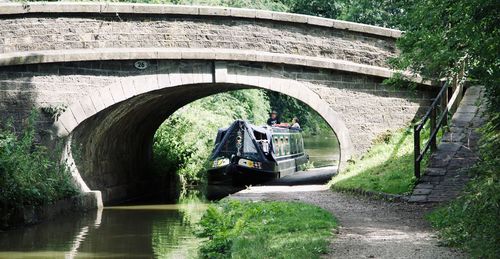 Arch bridge over river in tunnel