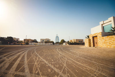 Buildings in city against clear sky