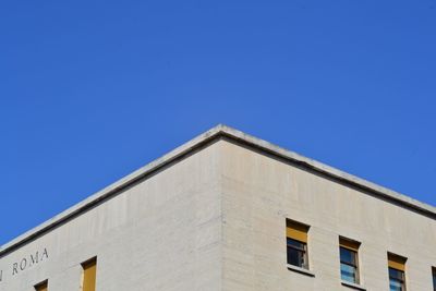 Low angle view of building against blue sky