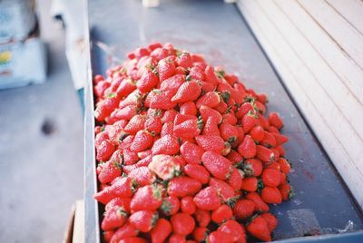 High angle view of strawberries in box at market