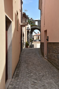 A narrow street between the houses of ruviano, a small village in the province of caserta in italy.