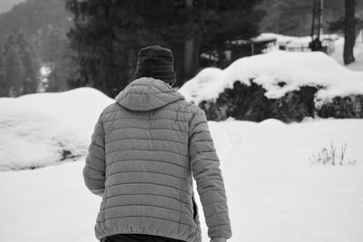 Rear view of man on snow 