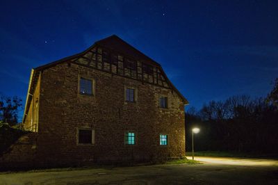 Low angle view of building against sky at night