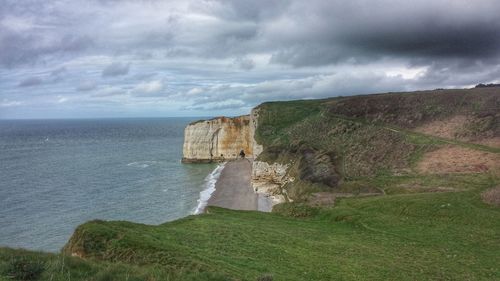 Scenic view of sea against cloudy sky