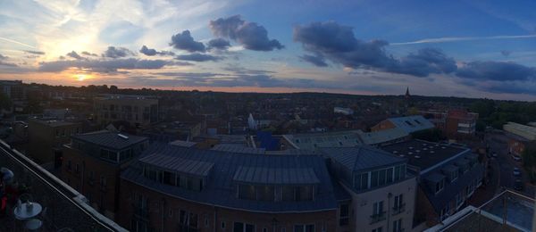 Cityscape against sky at sunset