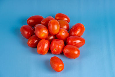 Red berries on blue table