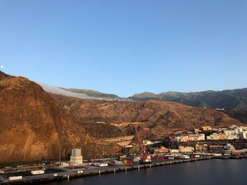 Scenic view of mountains against clear blue sky