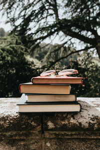 Close-up of books on table in park