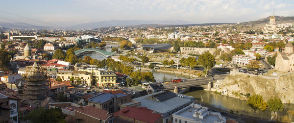 High angle view of houses in town against sky