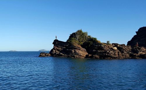 Scenic view of sea against clear blue sky