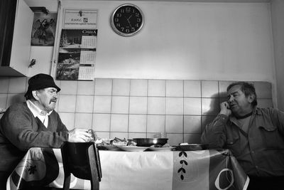 Men sitting on table