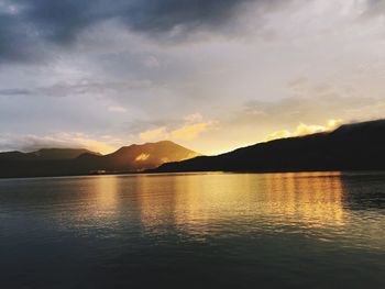 Scenic view of lake at sunset