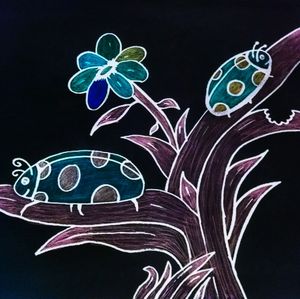 Close-up of light painting against black background