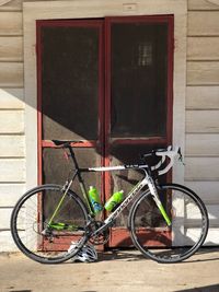 Bicycle against wall of building