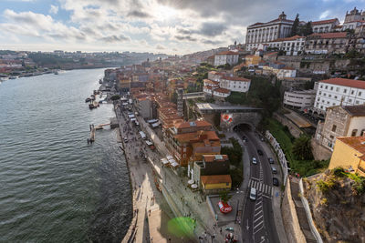 High angle view of buildings and sea against sky